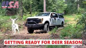 Moving and hanging deer stands and trail cameras