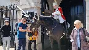 TOURIST BAG GOT STUCK in Horse's Mouth  The King's Guard smiled at Horse Guards in London